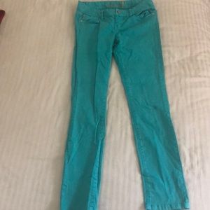 New turquoise American Rag “super skinny” jeans.